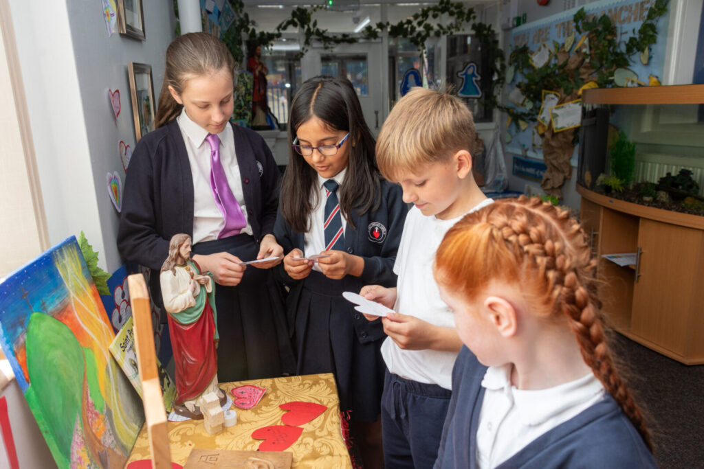 a picture of students around a cross