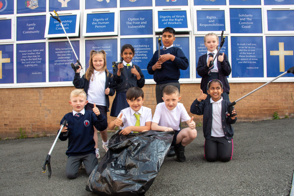 a group of students picking up rubbish