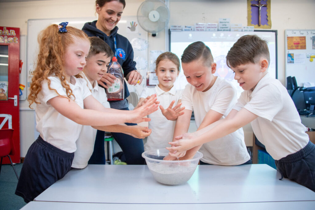 a picture of students playing with bubbles